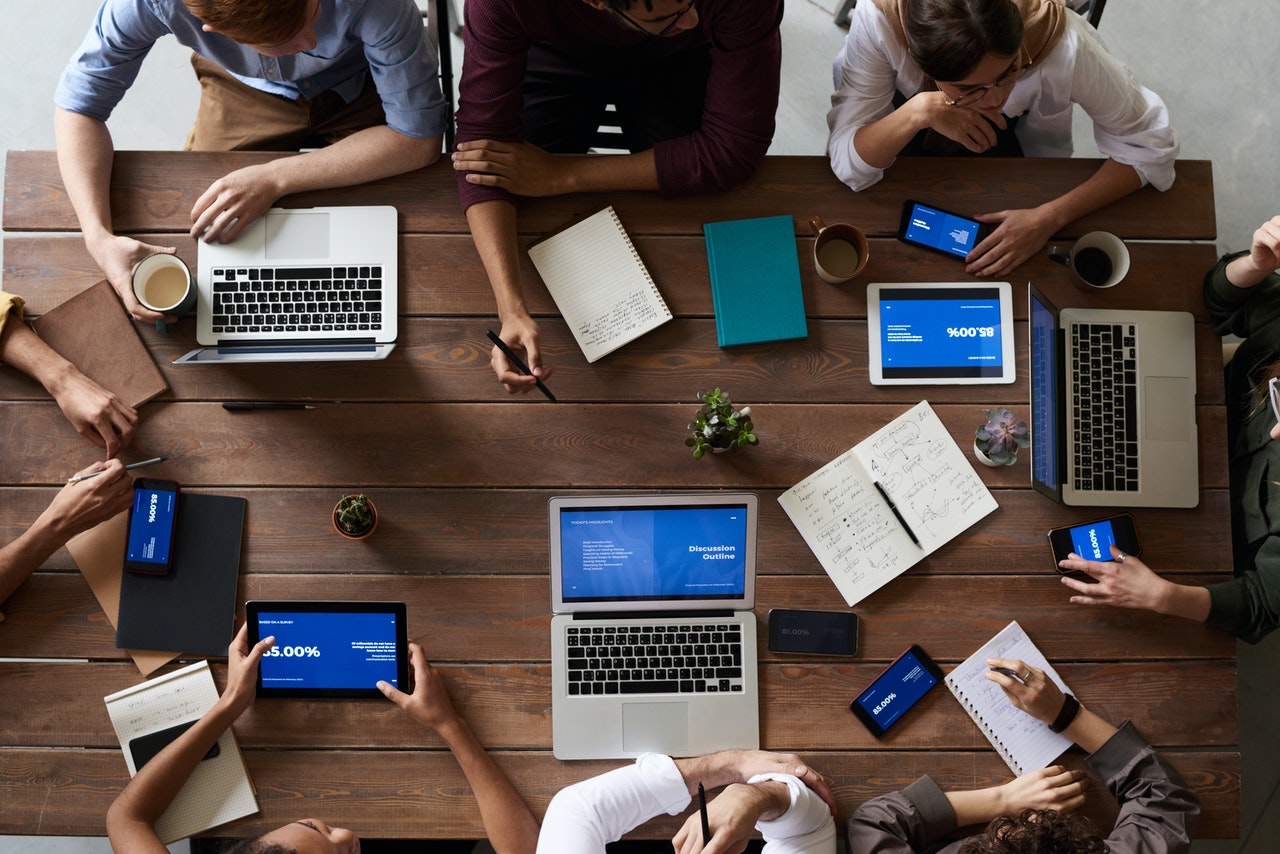 Image 1 - People Working around a table